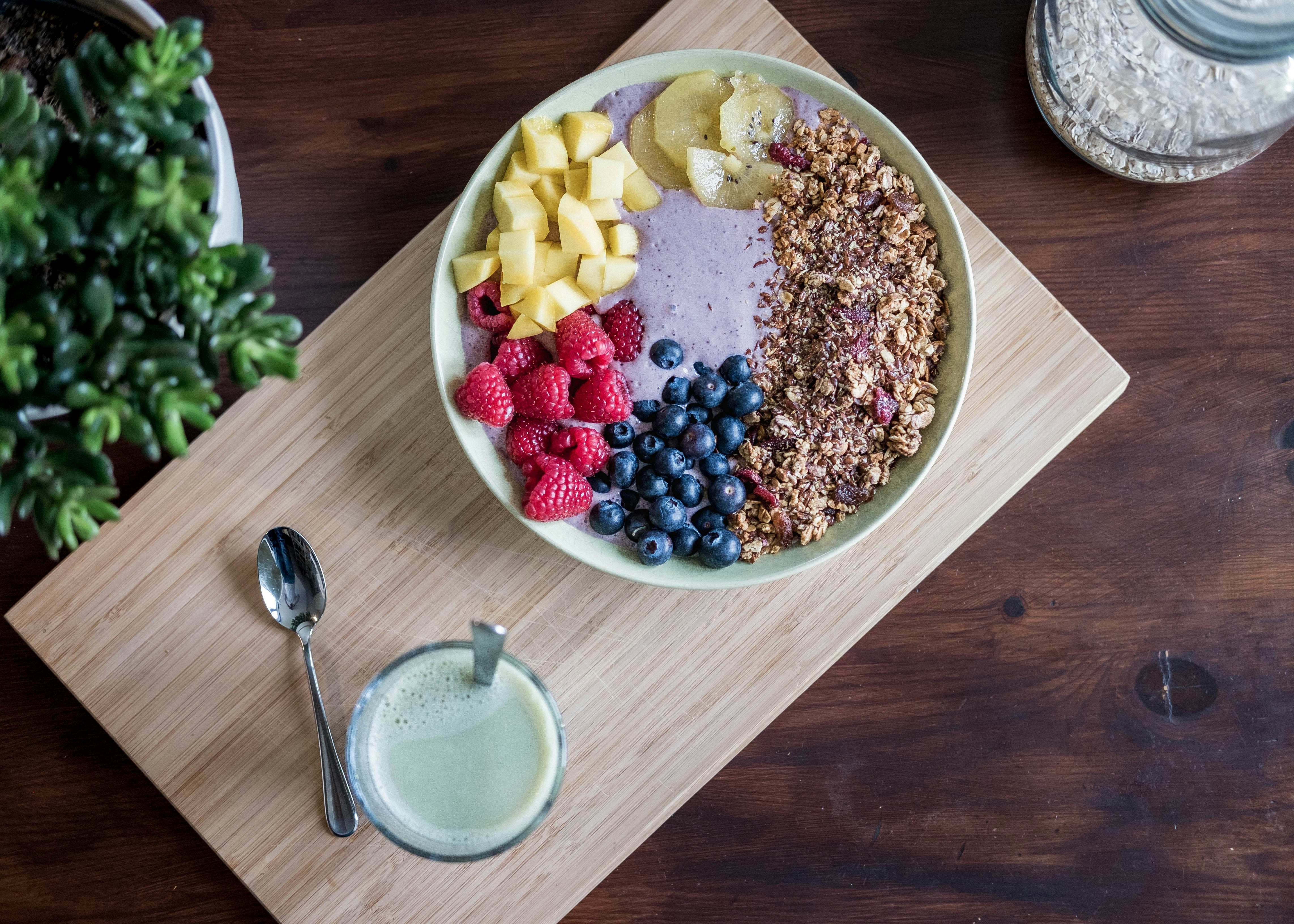 Heart-healthy foods arranged beside a heart shape